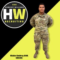 a man in uniform standing in front of a yellow background
